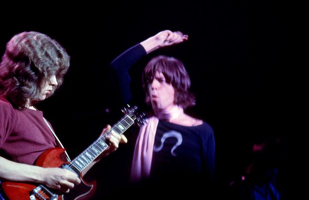 LIVERMORE, CA - DECEMBER 6: (L-R) English guitarist Mick Taylor and English singer, songwriter, actor, and film producer Mick Jagger of the English rock band The Rolling Stones perform during the Altamont Speedway Free Festival, which was a counterculture rock concert held on Saturday, December 6, 1969, at the Altamont Speedway in Livermore, California. (Photo by Jeff Hochberg/Rock Negatives)