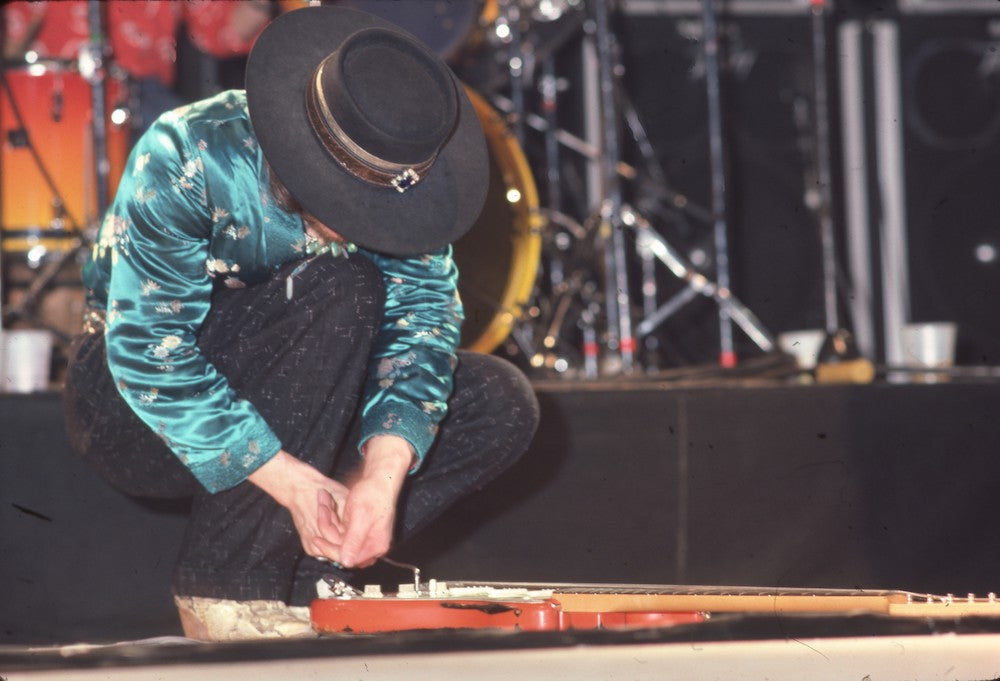 Stevie Ray Vaughan Fixing His Guitar on Soul to Soul Tour 1985 Photo Print